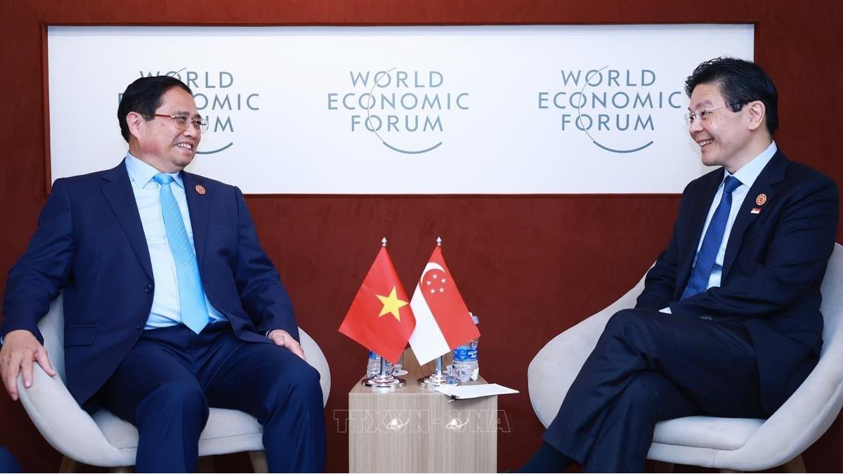 Thủ tướng Chính phủ Phạm Minh Chính gặp Thủ tướng Singapore nhân dịp dự Diễn đàn Kinh tế thế giới (WEF) tại Thiên Tân, Trung Quốc (25/6/2025)